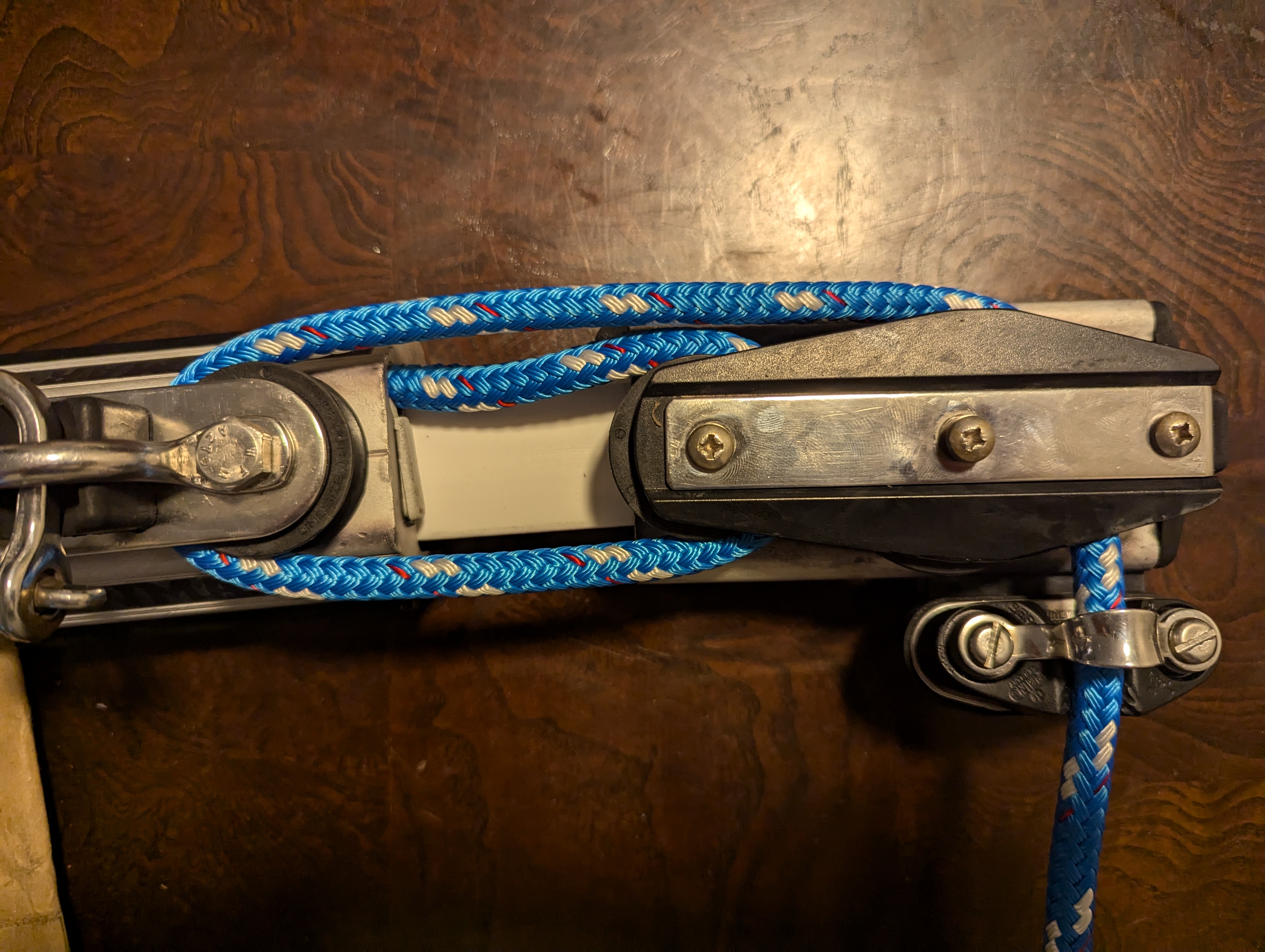 Closeup view of one end of the reassembled traveler highlighting the new control line set up in a 3:1 purchase.