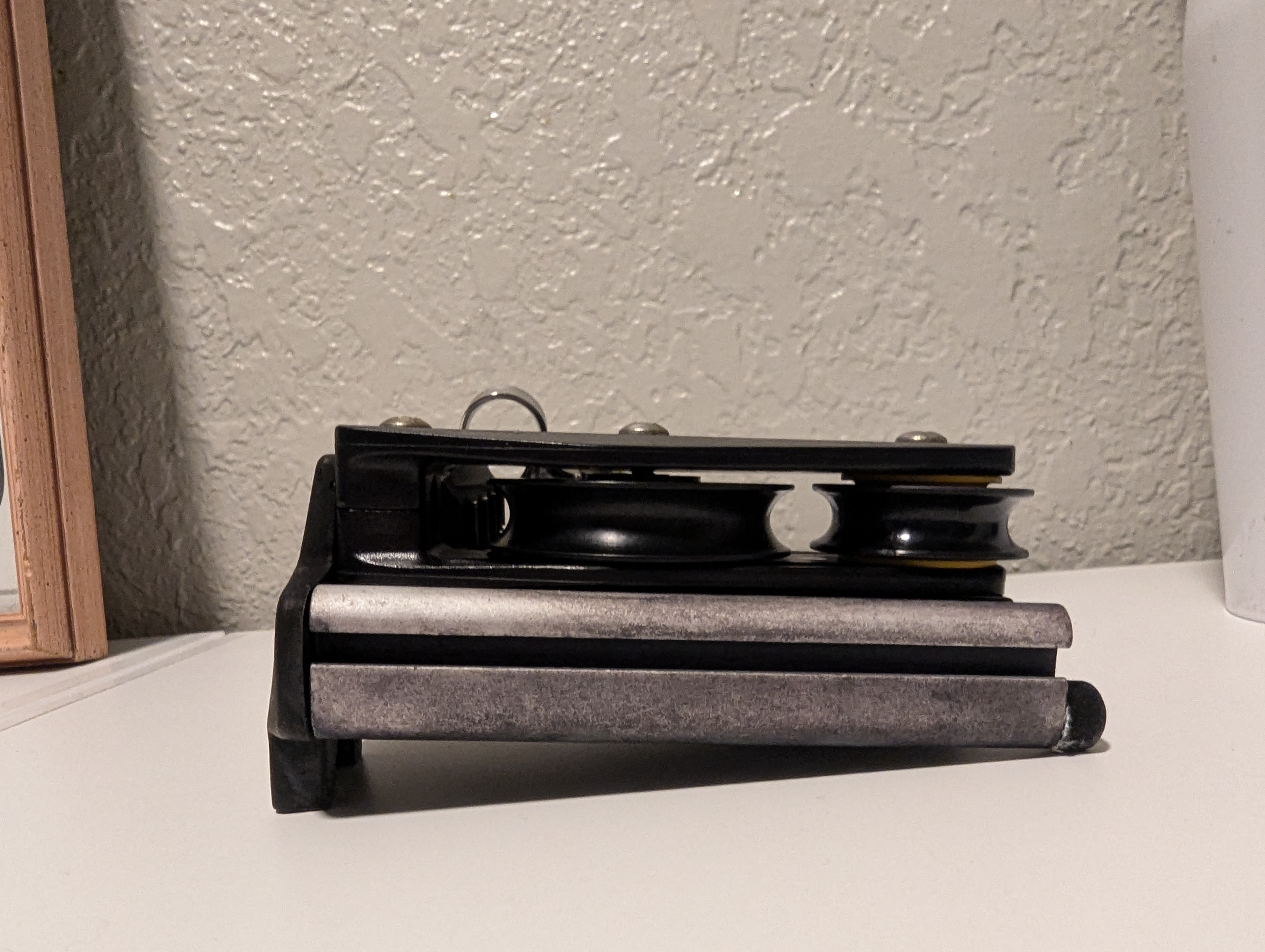 New sheaves installed without washer shim; the top side of the end block is bent slightly inwards because there is extra space between the middle sheave and the cheek of the block.